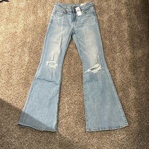 American Eagle next level stretch flare distressed denim 0R brand new w tags
